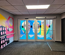 Automatic doors with color vinyls on the door. 