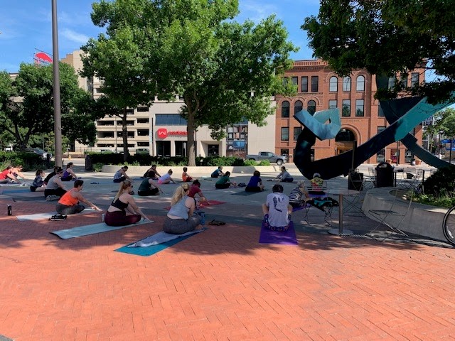 Stretching at Yoga on the Commons