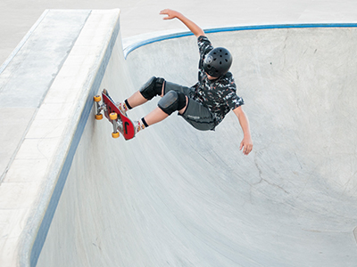 A boy riding a skateboard at the skatepark