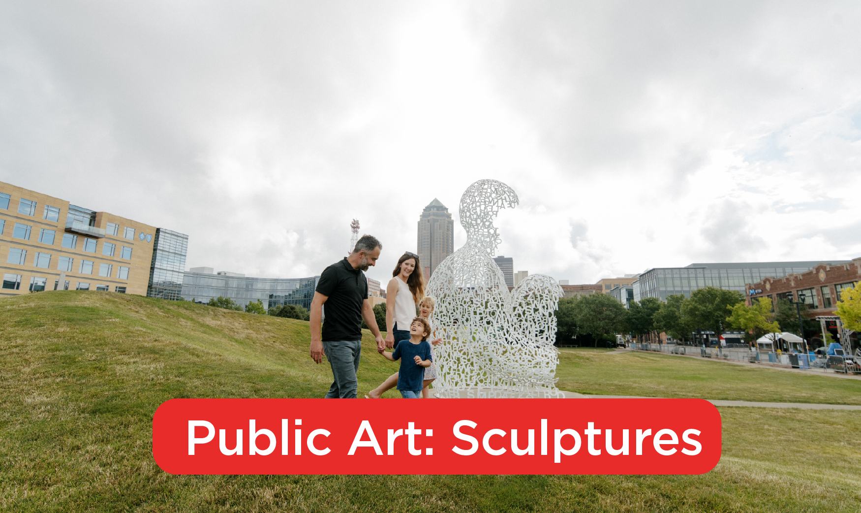 A family of four walking down a hill beside a sculpture of a man made of letters. Text covers the bottom of the photo reading: Public Art: Sculptures"