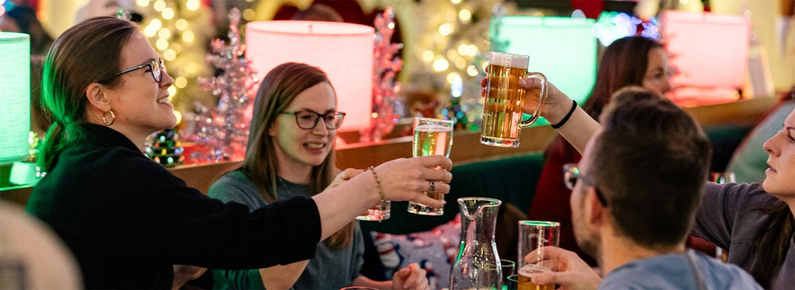 a cheers with friends at Either Or in Des Moines, Iowa