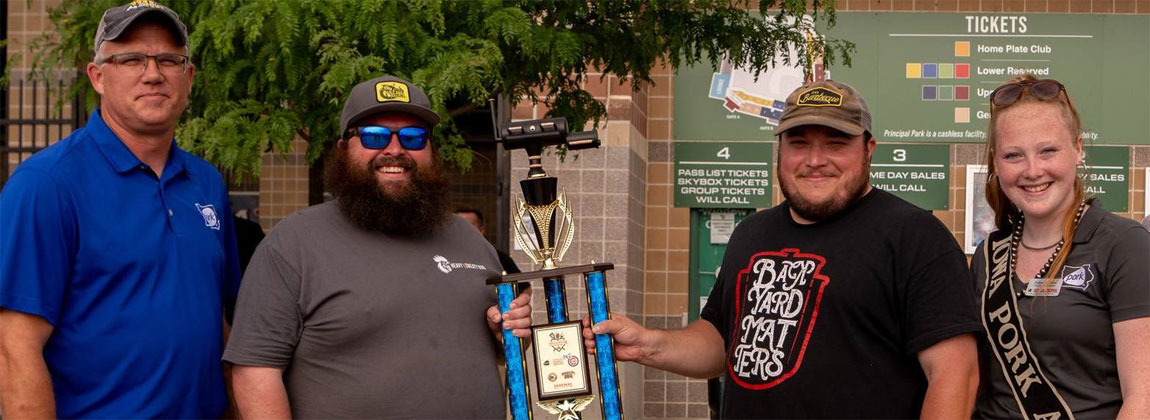 people holding a trophy
