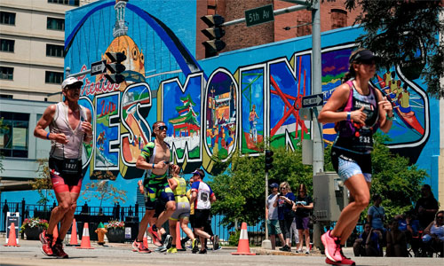IronMan Des Moines athlete running in Downtown DSM