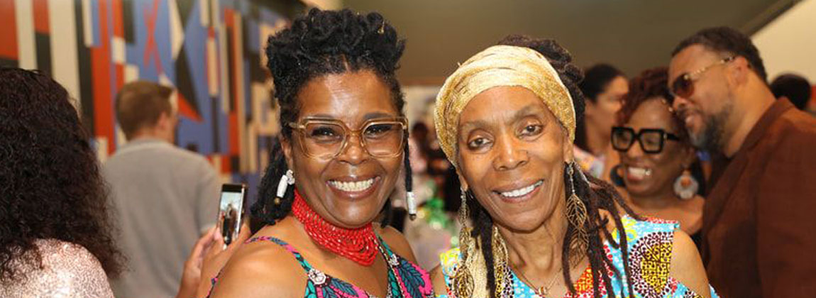 two women posing together