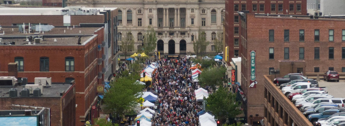 crowd on Court Avenue with farmers' market booths