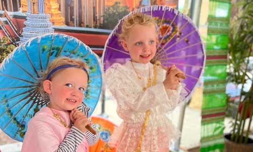 two girls with umbrellas