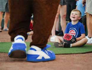boy at an Iowa Cubs game