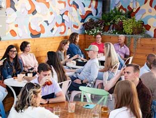 people enjoying drinks on the patio