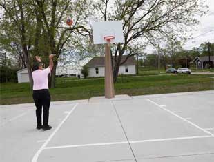 man playing basketball at a Des Moines park