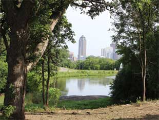 view of Downtown Des Moines through the trees