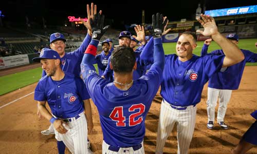 Iowa Cubs players high-fiving