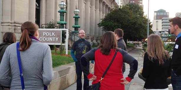 people looking at Des Moines buildings