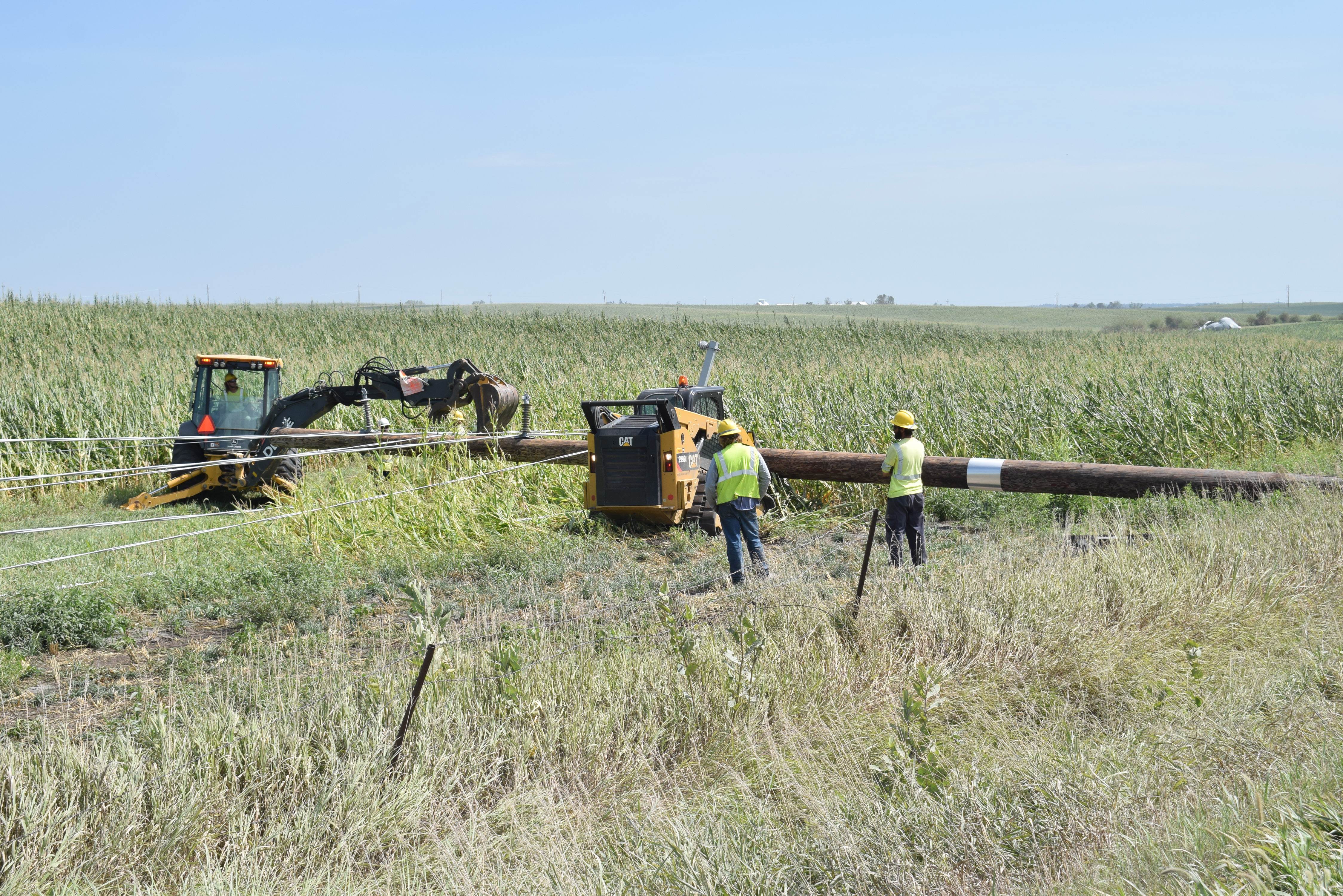 Utility Workers at Damaged Pole in Belle Plaine