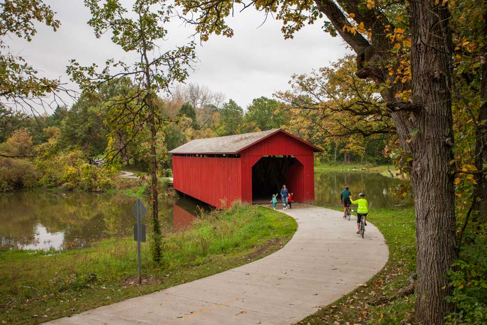 Madison County bridge people near a covered bridge