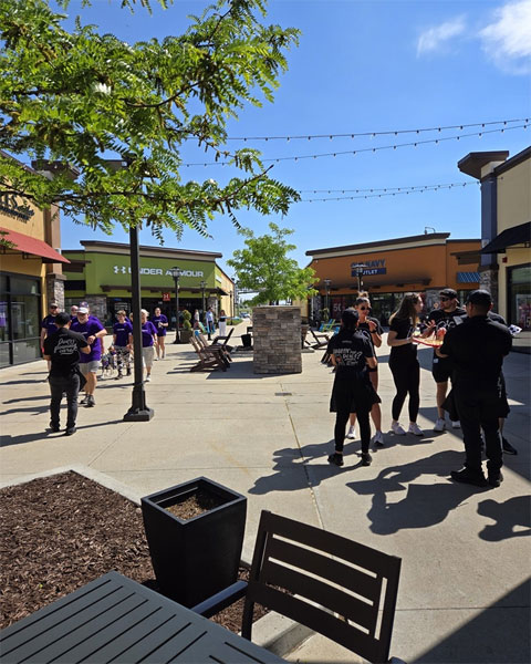 Outlets of Des Moines people shopping outdoors