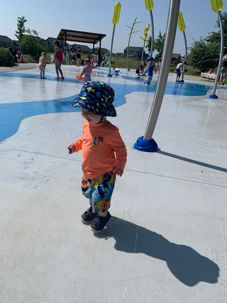 Fox Creek Splash Pad young boy at splash pad