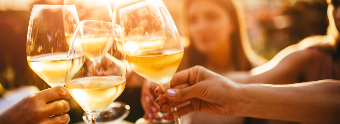 people clinking wine glasses