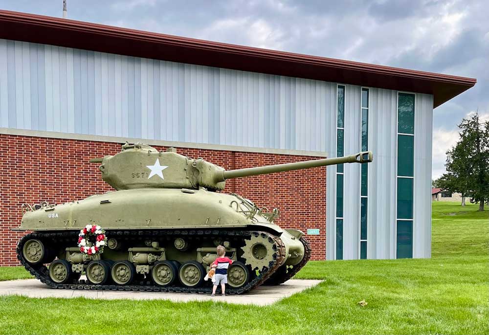 Iowa Gold Star Military Museum child with tank outside a military museum