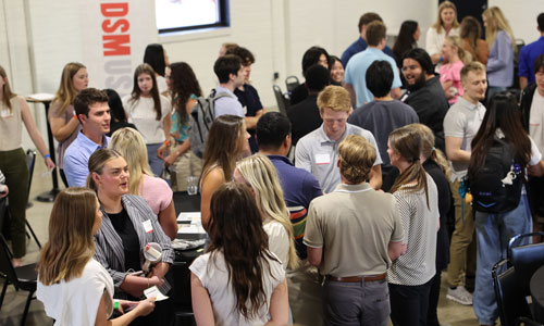 students and interns around table