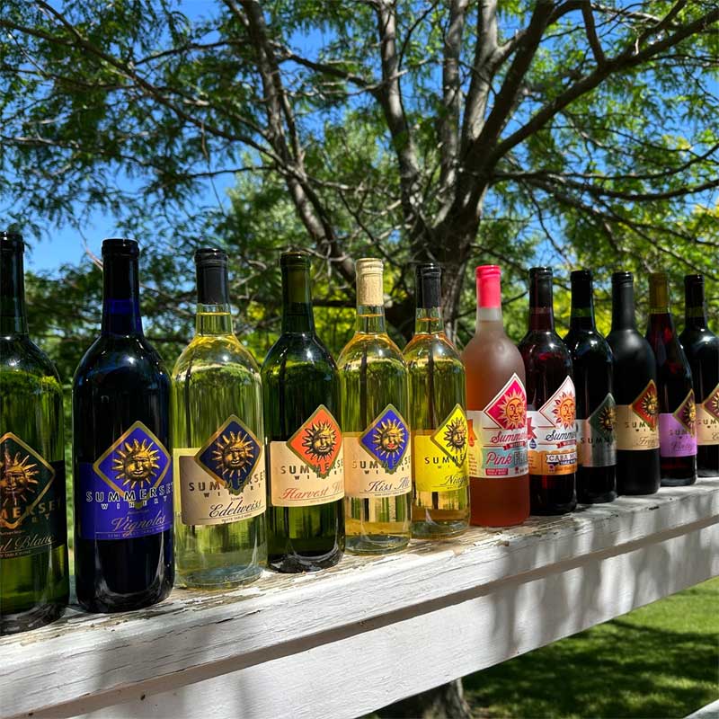 Summerset Winery bottles lined up on fence