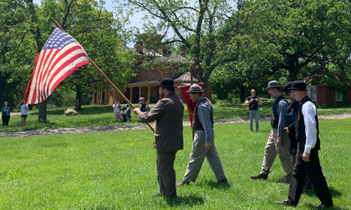 people carrying flag at Living History Farms event
