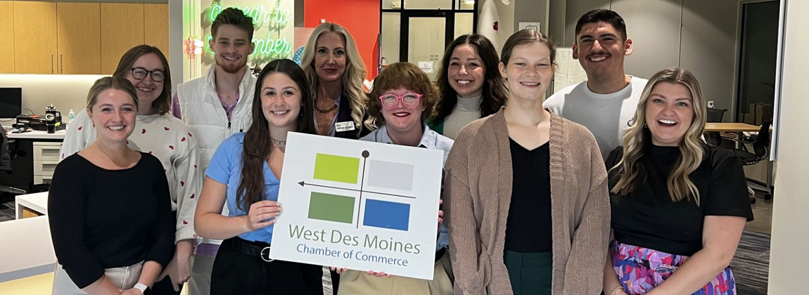 WDM Chamber staff holding a sign