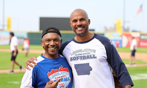 Legislative Softball Game two baseball players posing on the field
