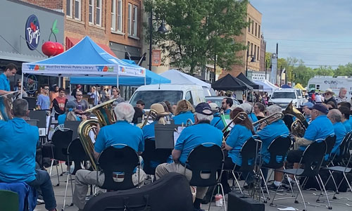 people playing instruments at the Valley Junction Farmers' Market
