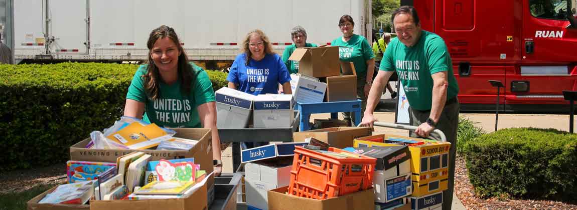 group of people moving books