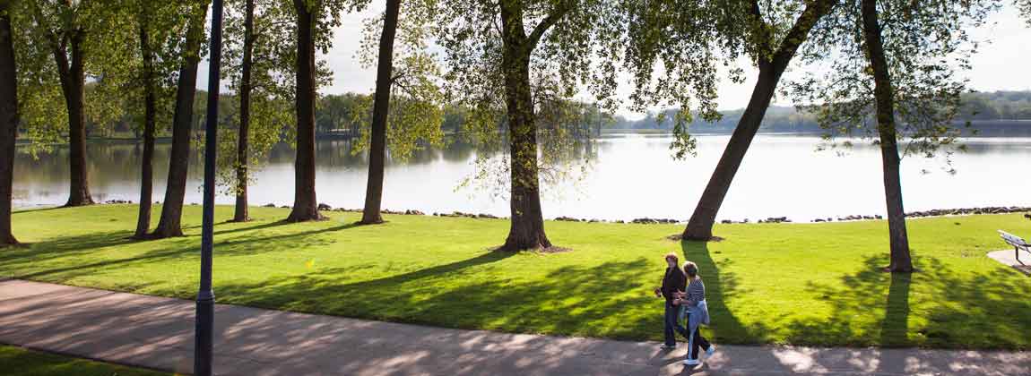 two people walking near Gray's Lake