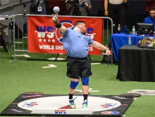 athlete throwing shot put