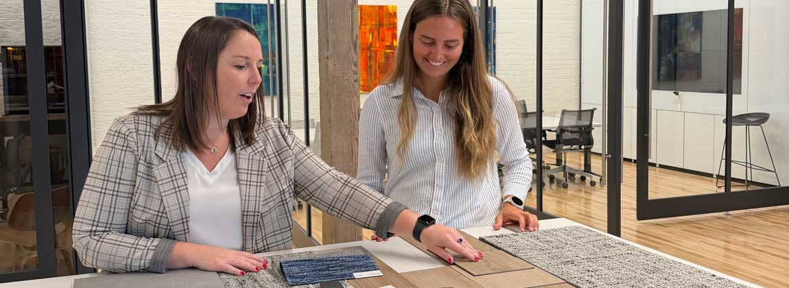 two women discussing design options