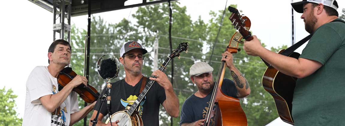 bluegrass band members playing instruments
