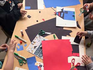 children creating paper houses