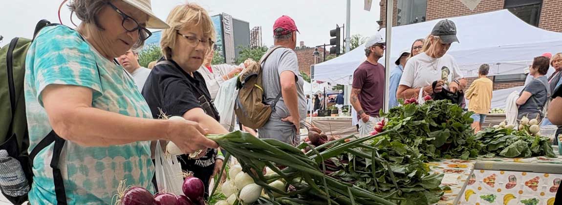 ladies buying produce
