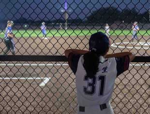 girl enjoying a softball game