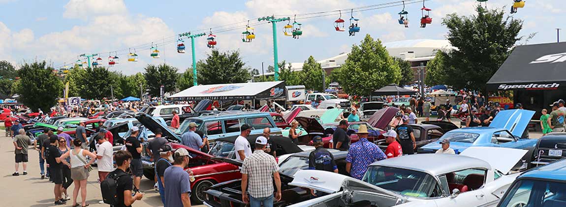 crowd looking at cars
