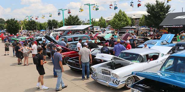 crowd looking at cars