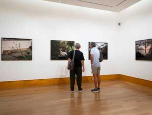two people looking at art