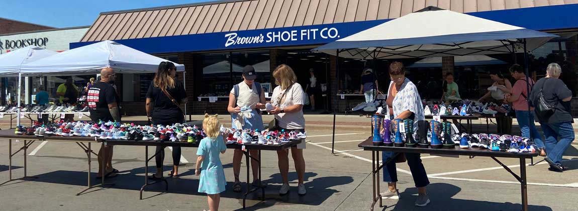 shoppers at a Ridiculous Day vendor booth