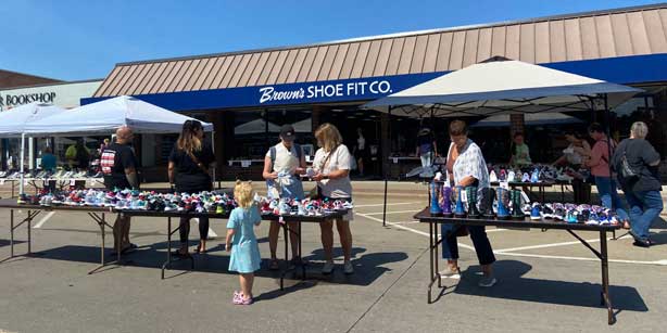 shoppers at a Ridiculous Day vendor booth