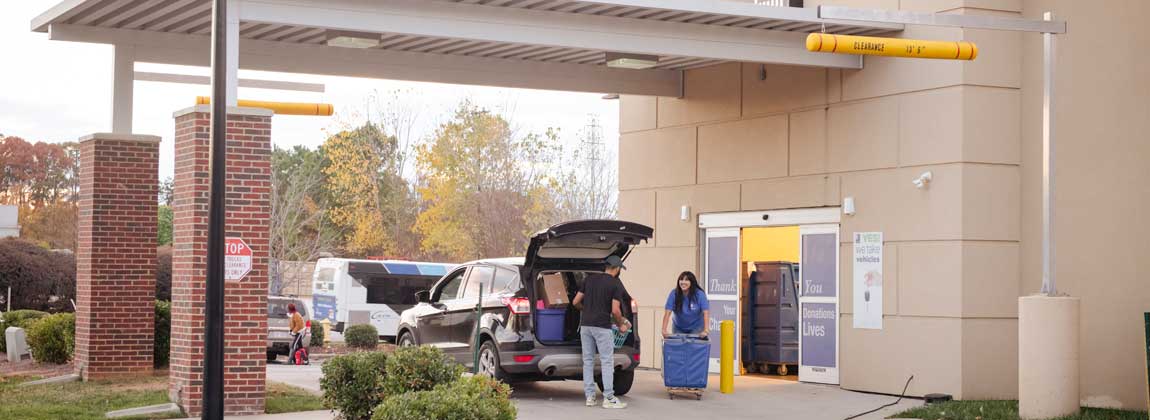 a person dropping off a donation at a Goodwill location