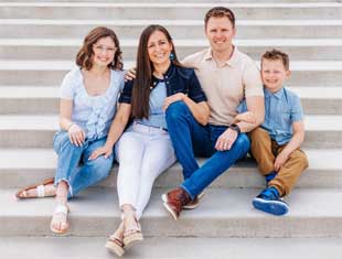 four people posing