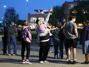 people looking at the night sky