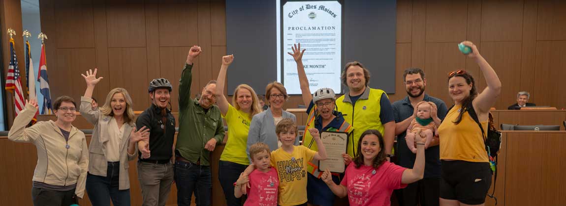 group of people posing with mayor for Bike Month