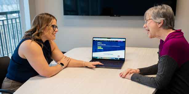 two people discussing GIVEdsm.org
