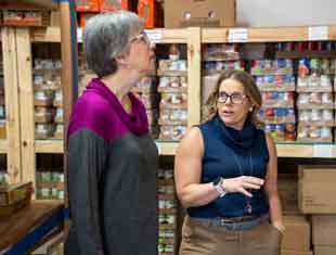 two people at a food pantry
