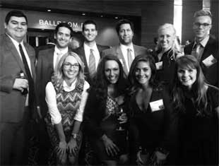 group of people posing at an awards ceremony