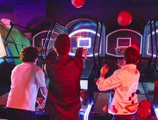 three boys playing basketball