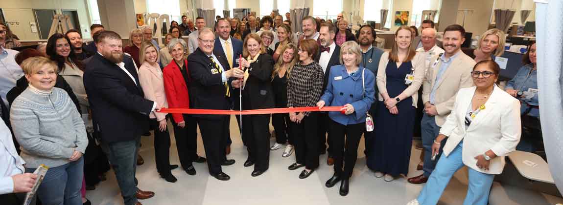 group of people at new clinic ribbon cutting